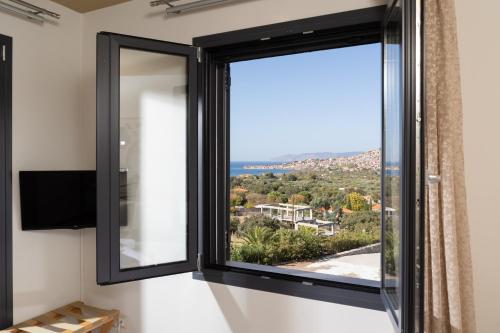 a room with a window with a view at Lampetos Houses Molyvos in Mithymna