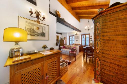 a living room with a table with a lamp on it at Casa San Giovanni 1 a Vinigo in Vinigo