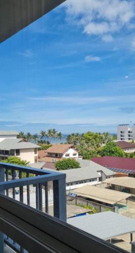 a view of a city from a balcony at Cosy SeaView, High Floor, free Netflix in Bangsaen