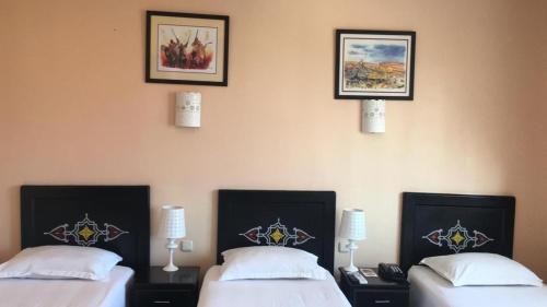 Postel nebo postele na pokoji v ubytování Hôtel Texuda