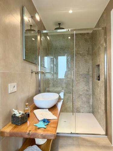 a bathroom with a sink and a shower at Villa Berenike in San Teodoro