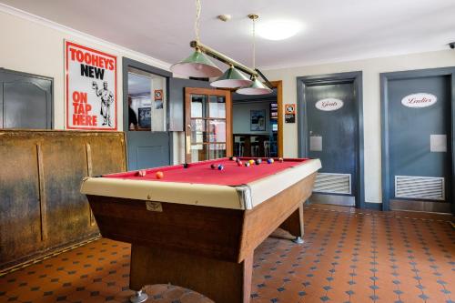a billiard room with a pool table in it at Peel Inn Hotel Nundle in Nundle