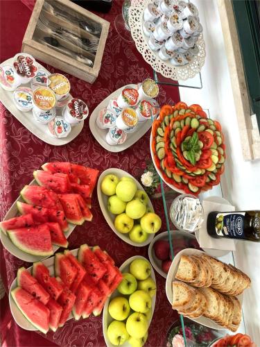 a table topped with lots of different types of food at Villa Adriana Hotel in Tivoli