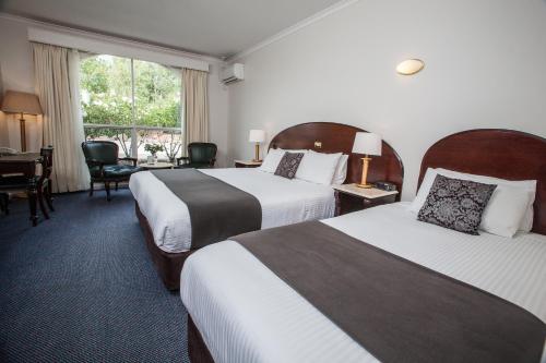 Кровать или кровати в номере Mercure Ballarat Hotel & Convention Centre