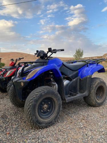 two atvs parked on the side of a road at Les cavaliers chez Yassine in Marrakech