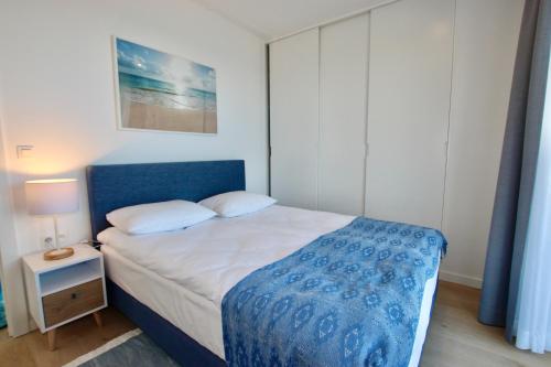 Ένα ή περισσότερα κρεβάτια σε δωμάτιο στο Apartamenty Marina z widokiem na morze