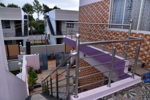 a metal staircase on the side of a building at JK Palace in Yelagiri