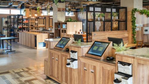 a store with several computers on display in a store at EIGHT POINT INN Kanazawa in Kanazawa