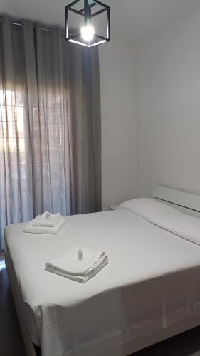 Ένα ή περισσότερα κρεβάτια σε δωμάτιο στο H24 apartment