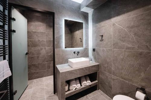 a bathroom with a sink and a mirror at Villa Lazareto in Kontokali