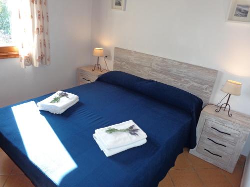 Postel nebo postele na pokoji v ubytování Finca ca n'Andreu