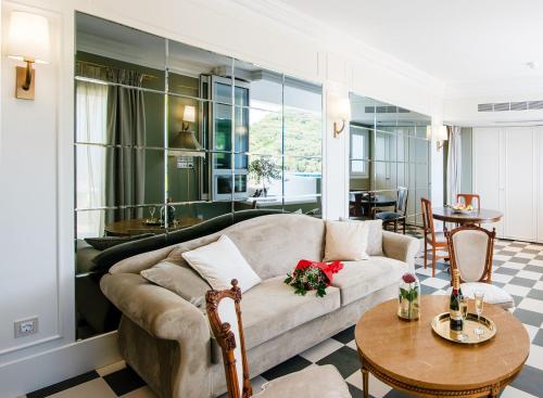 a living room with a couch and a table at Irida Parga in Parga