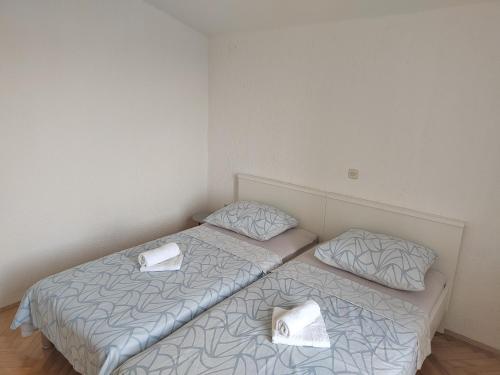 Ένα ή περισσότερα κρεβάτια σε δωμάτιο στο Apartman Eva