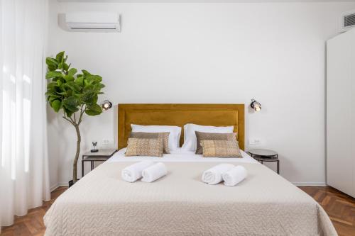 Ένα ή περισσότερα κρεβάτια σε δωμάτιο στο Dana Opatija