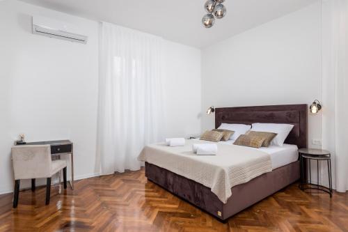 Ένα ή περισσότερα κρεβάτια σε δωμάτιο στο Dana Opatija