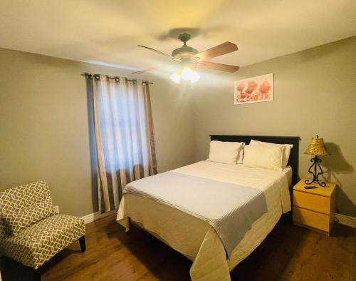 a bedroom with a bed and a ceiling fan at Holiday Home 7865LL in Niagara Falls