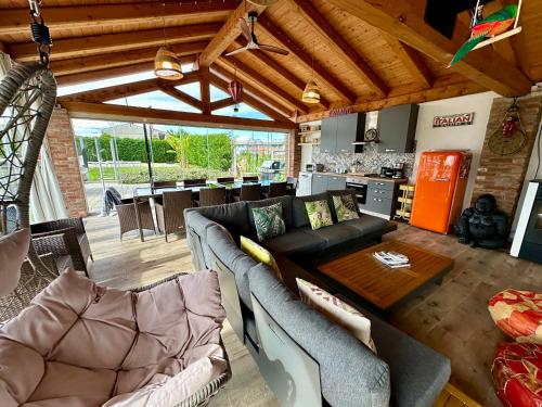 a living room with a couch and a table at Family Relais La Magnolia in Villanova dʼAsti