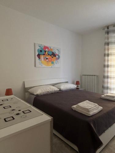 Ένα ή περισσότερα κρεβάτια σε δωμάτιο στο Casa Vacanze Estivia