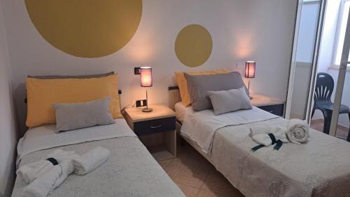 Postel nebo postele na pokoji v ubytování MariMare B&B