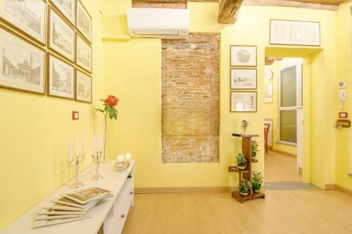 a bathroom with a sink and a brick wall at CozyBricks in Lucca - Apartments in Lucca Historical Center - Air Cond & WiFi - in Lucca