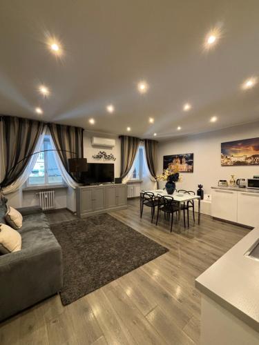 a large living room with a couch and a table at Casa Florian in Turin