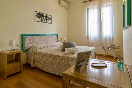 Postel nebo postele na pokoji v ubytování Tana del Cinghiale