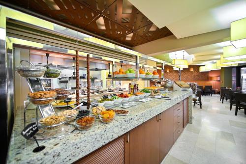 a buffet line with a lot of food on it at Yerevan Place Hotel in Yerevan