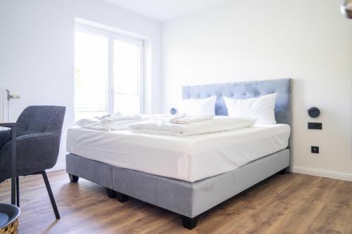 Ένα ή περισσότερα κρεβάτια σε δωμάτιο στο Johouse Zingst Johouse Zimmer 04