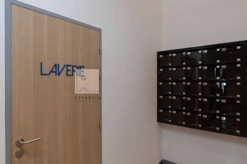 a door with the words leapert on it next to a wall at Perla 403, une Oasis luxueuse au coeur de CASA ! in Casablanca