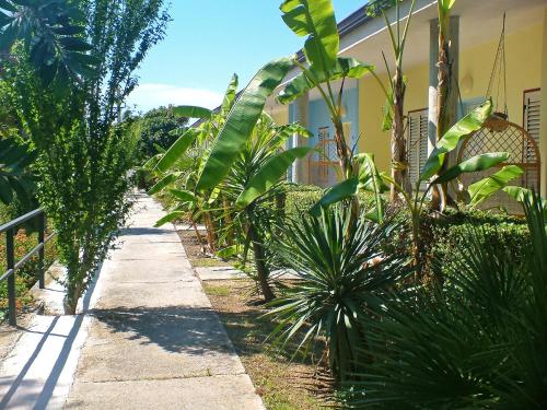 a garden with plants on the side of a house at Apartment Dependance-2 by Interhome in Santa Maria