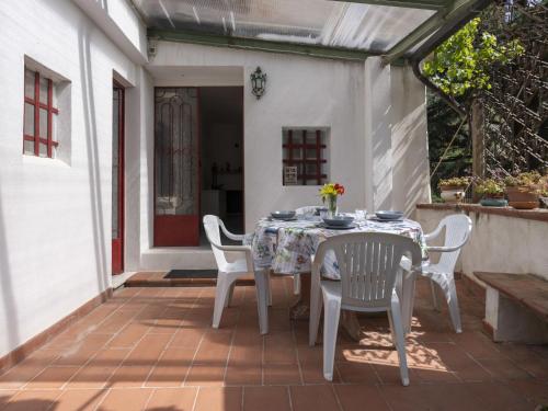 a table and chairs sitting on a patio at Holiday Home Il Castagneto by Interhome in Taggia