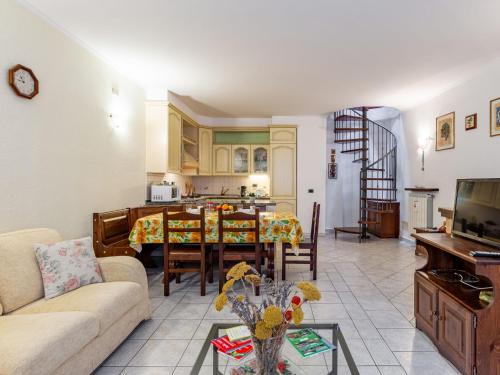 a living room with a couch and a table at Holiday Home Girasole by Interhome in Corrido