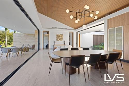 an open dining room with a table and chairs at Zen Oasis Villa at Casa de Campo in La Romana