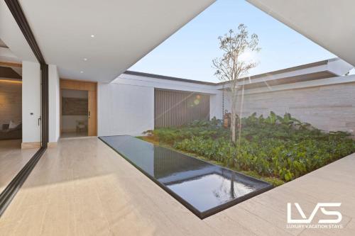 an external view of a house with a swimming pool at Zen Oasis Villa at Casa de Campo in La Romana