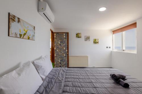 Ένα ή περισσότερα κρεβάτια σε δωμάτιο στο Dream Seaview Loft