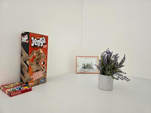 a box of lego and a plant on a table at Cocon cosy au cœur de Verneuil in Verneuil d’Avre et d’Iton