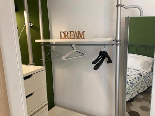 a dream sign on a shelf in a bedroom at Garbatella Garden Home in Rome