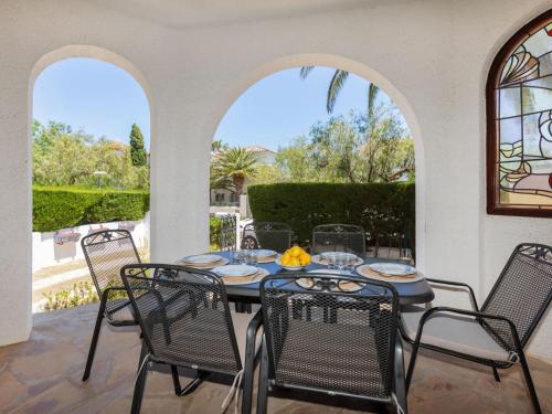 a patio with a table and chairs on a patio at Holiday Home Avellaner by Interhome in Miami Platja