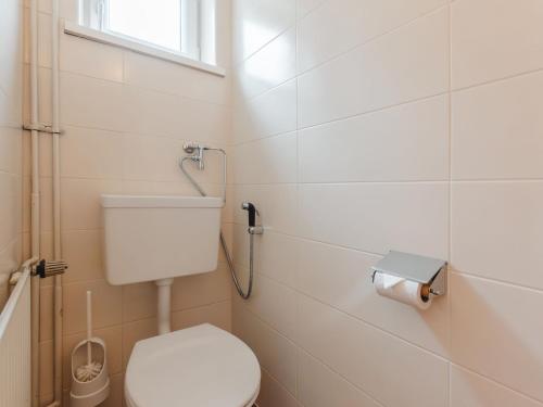 a bathroom with a toilet and a shower at Holiday Home Rübezahl-3 by Interhome in Bad Hofgastein