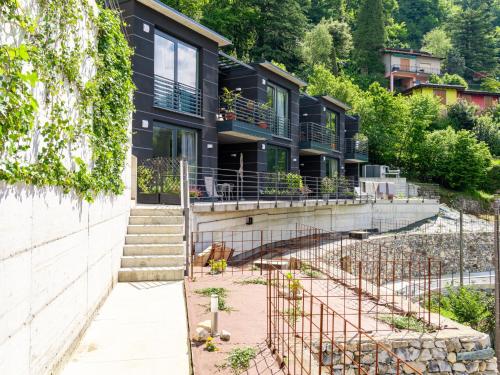 a house with a garden in front of it at Apartment Lakeview Terrace by Interhome in Nesso