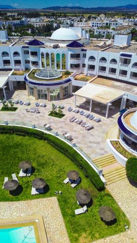 an aerial view of a large building with a courtyard at Royal Tulip Taj Sultan in Hammamet