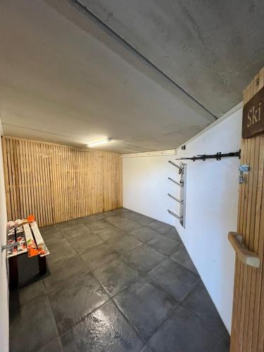 an empty garage with a room with a sign on the wall at Apartment Bergglück Stummerberg in Stummerberg