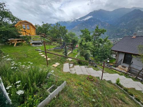 a house on top of a hill with a playground at Agrihouseross in Mattie