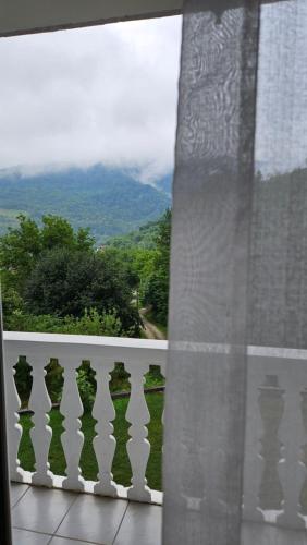 a window with a view of a mountain view at M&M Bazen resort Goražde in Goražde