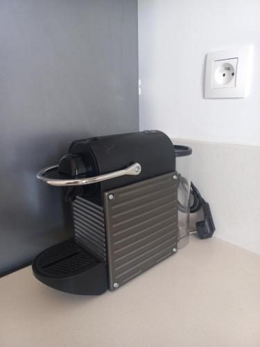 a coffee machine sitting on top of a table at Soleil & Compagnie Cabo Huerto in Cabo Negro