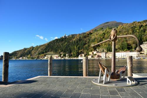 a playground on a pier next to a body of water at Casa Vacanze Matisse in Toscolano Maderno