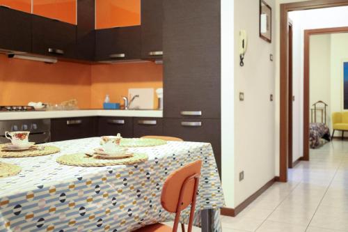 a kitchen with a table with two plates on it at Gioiella, pool & lake in Desenzano del Garda