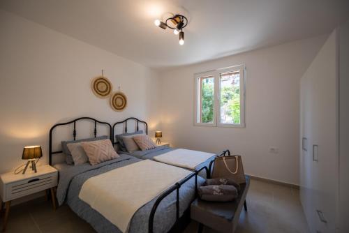 Postel nebo postele na pokoji v ubytování Villa Bokeljka