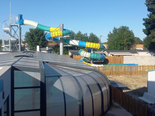 a water park with a roller coaster at CAMPING PARADIS Domaine Oyat in Le Fenouiller