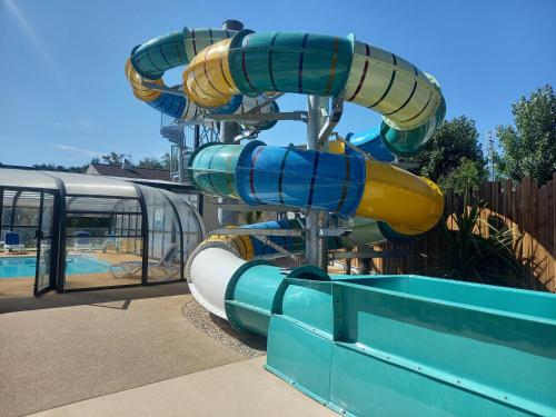 a water slide at a water park at CAMPING PARADIS Domaine Oyat in Le Fenouiller